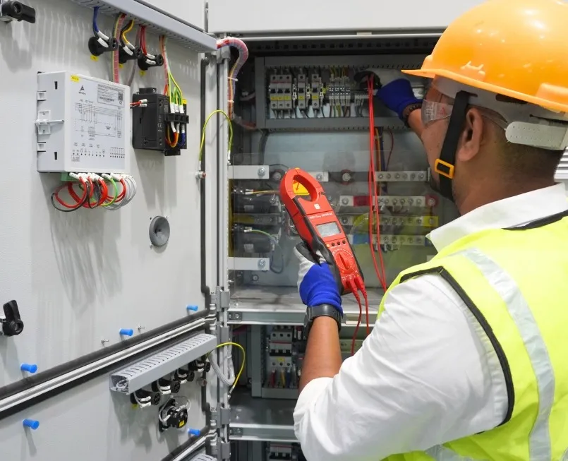 Engineer testing a switchgear panel in the test bay