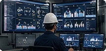 Engineer at a modern control-room workstation